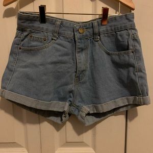 Denim shorts with rips in the back